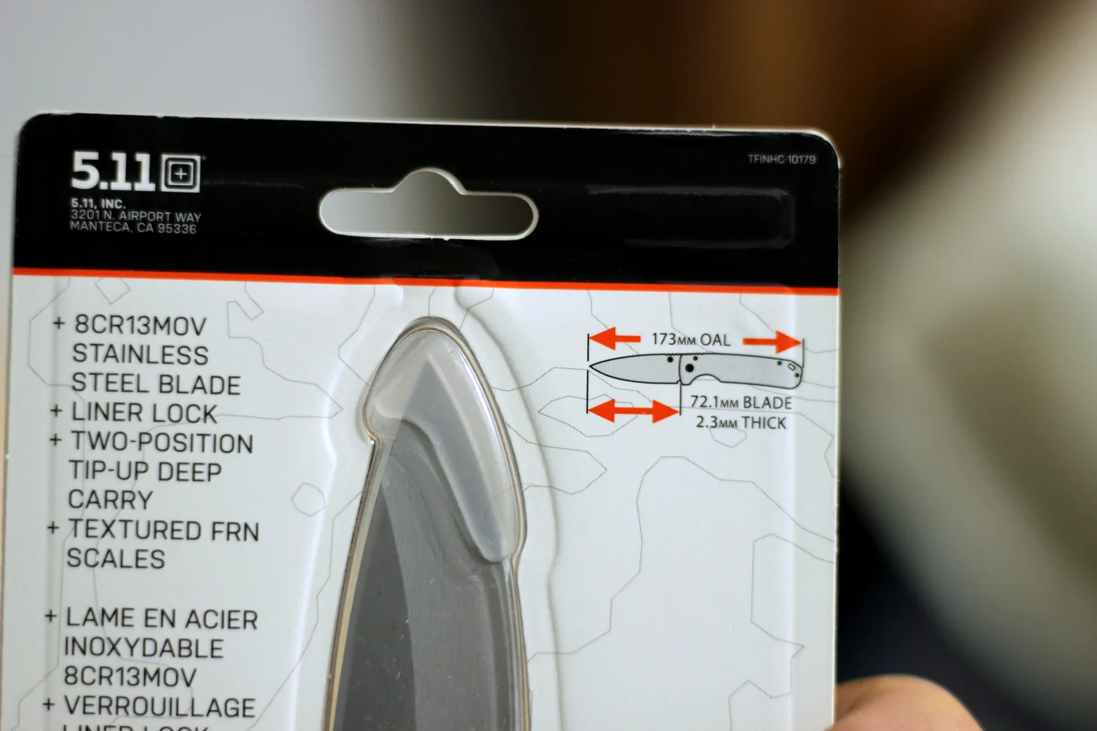 The knife hang card showing a line drawing with 173mm OAL, 72.1mm blade and 2.3mm thick called out in red
