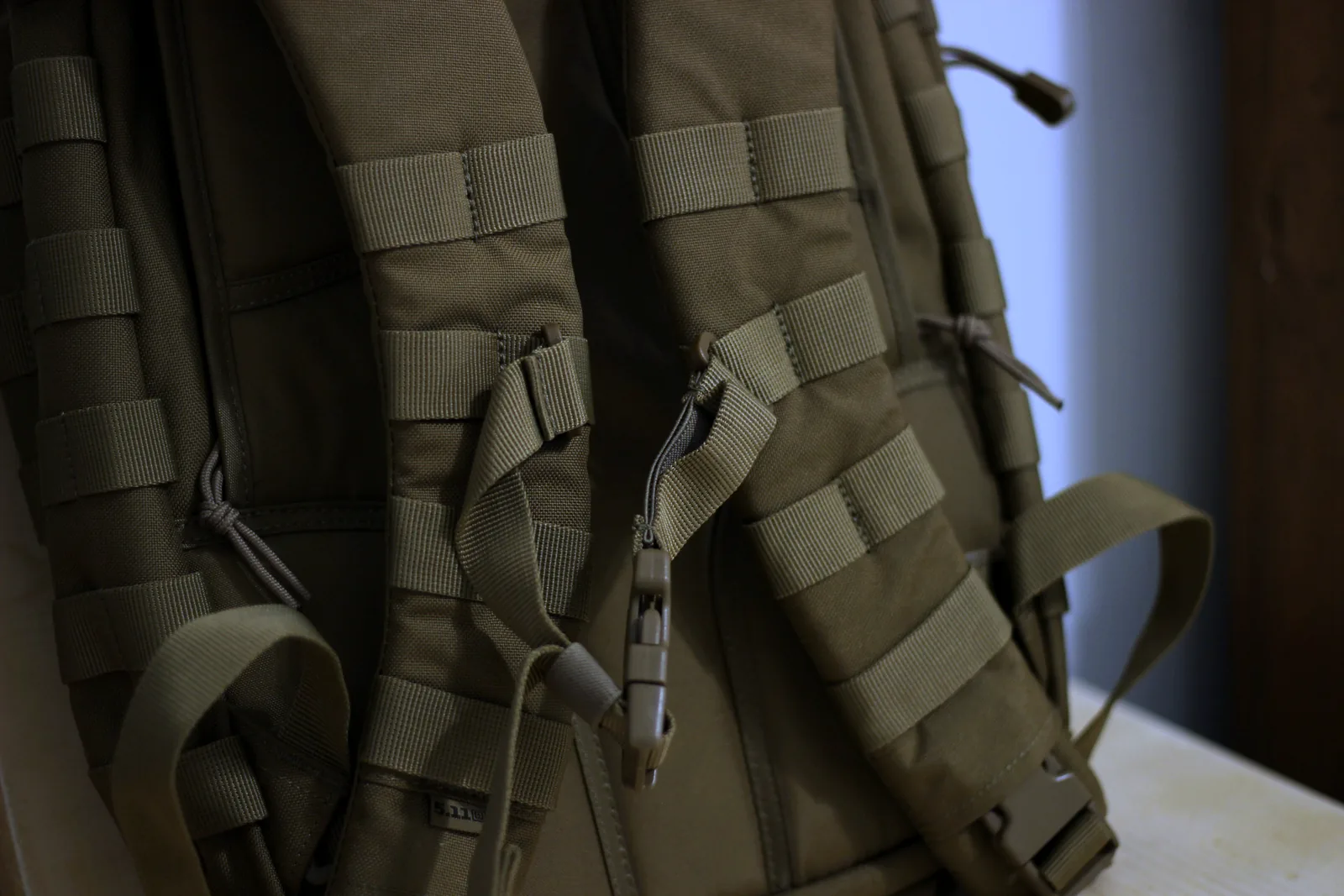 The back of the RUSH 12 showing the contoured shoulder yoke, padded back panel and webbing