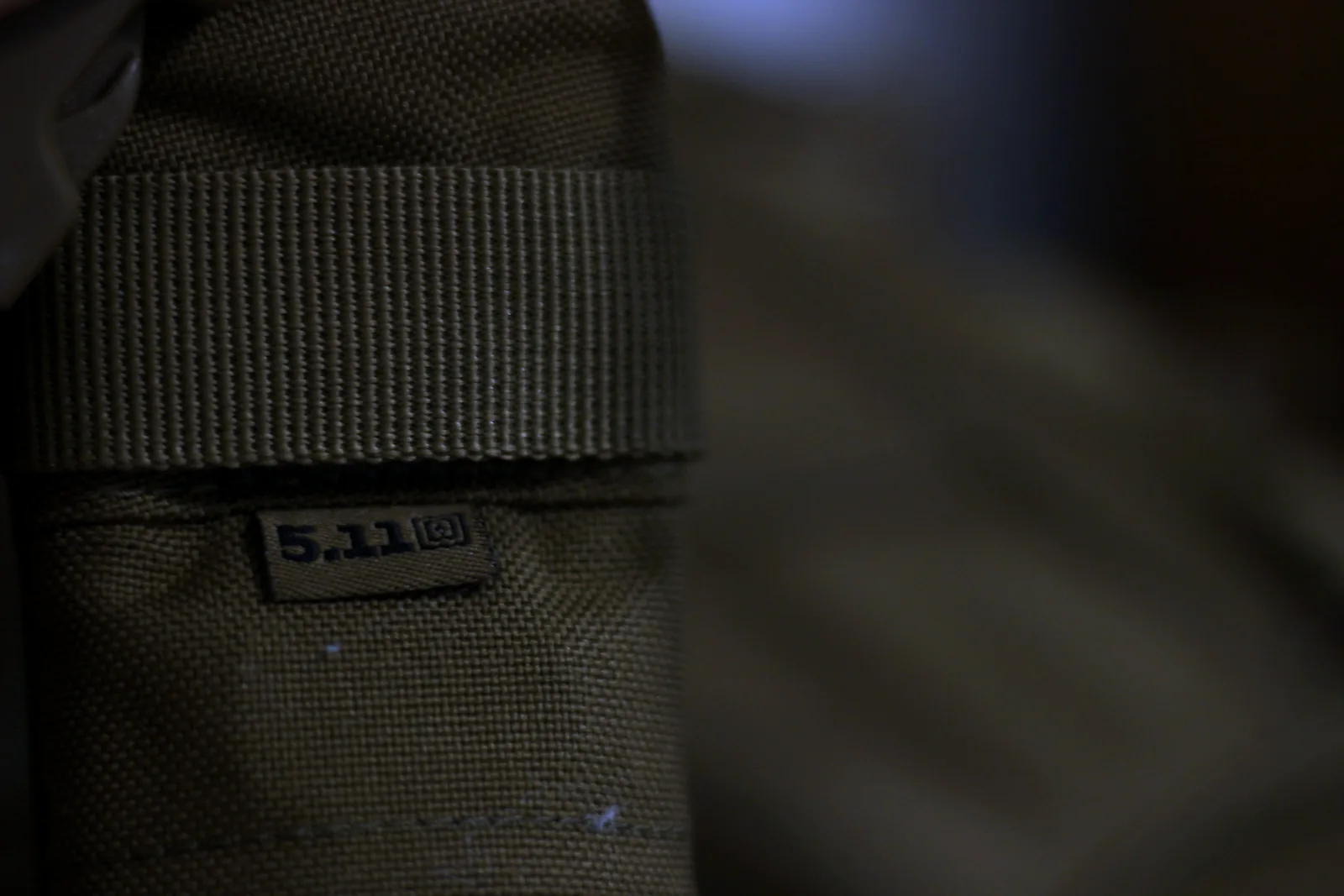 The 5.11 mark on a woven label stitched to the webbing of the pack