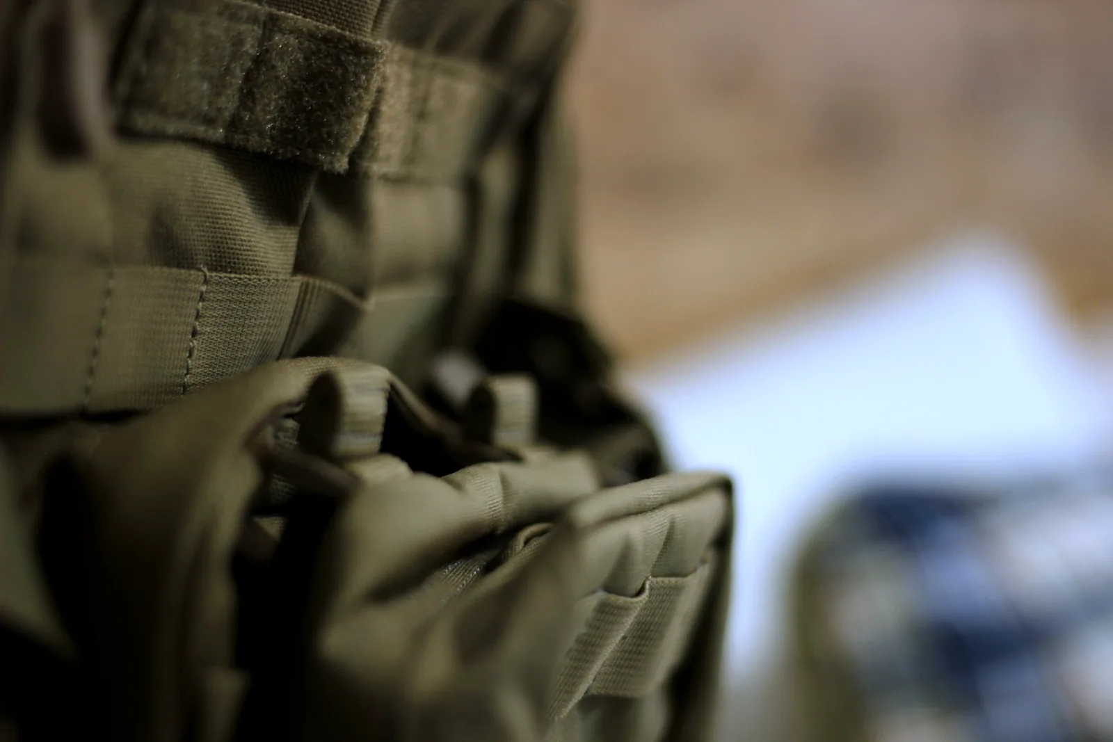 A hook-and-loop patch panel above a pocket on the pack front