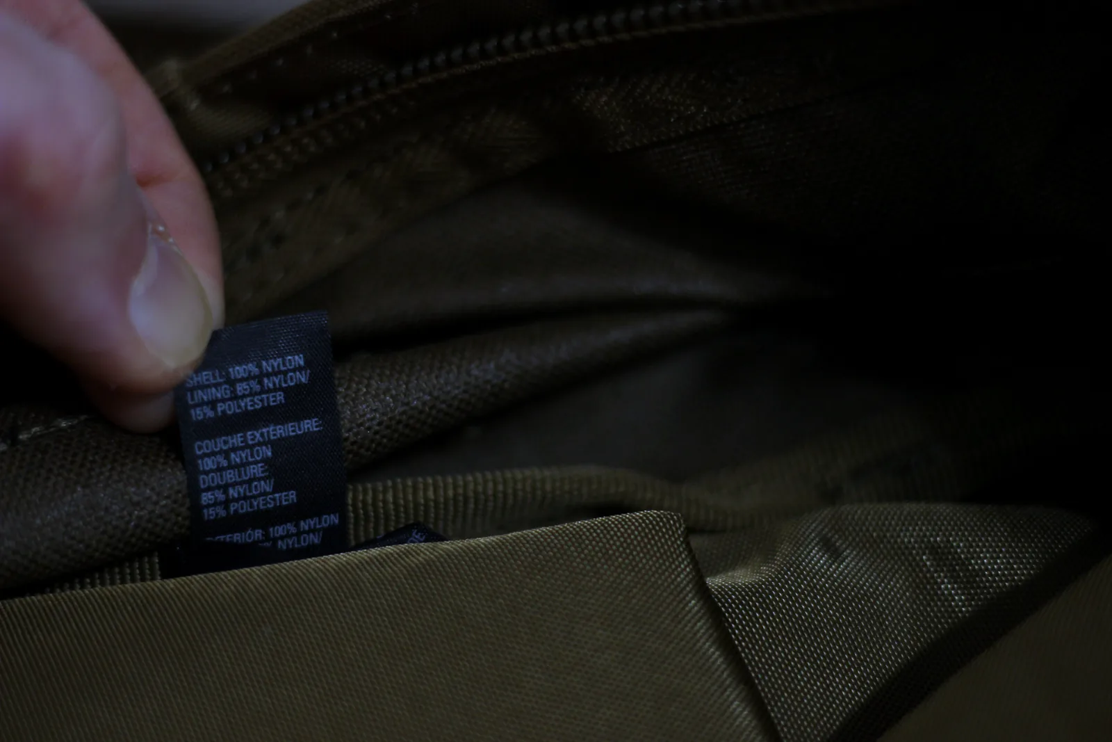 The care label inside the pack reading shell 100% nylon and lining 100% nylon 50% polyester