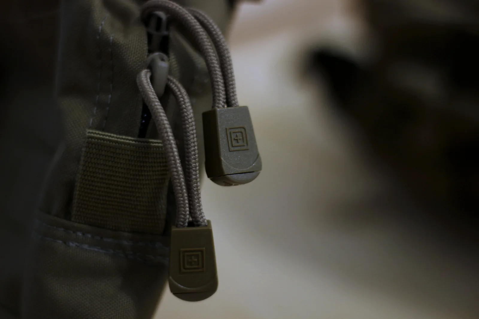 Corded zip pulls with moulded 5.11 tabs on the pouch