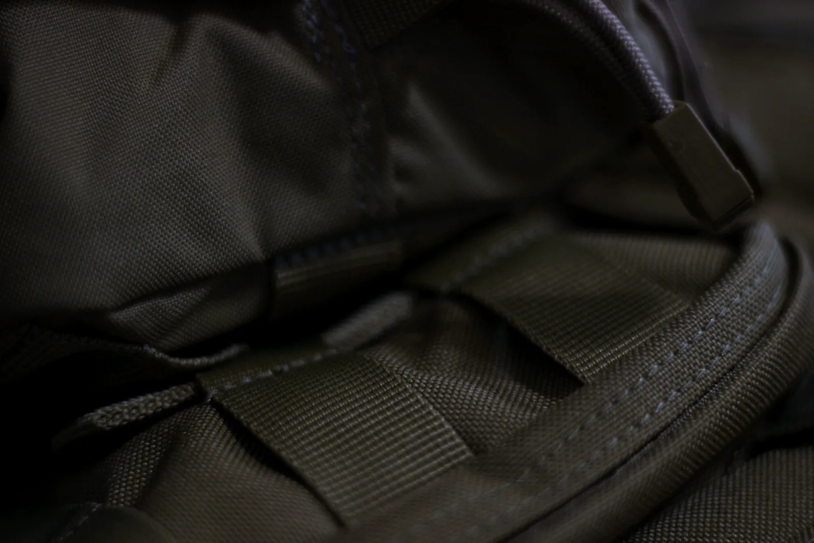 The mounting strap tucked flat against the body of the pouch