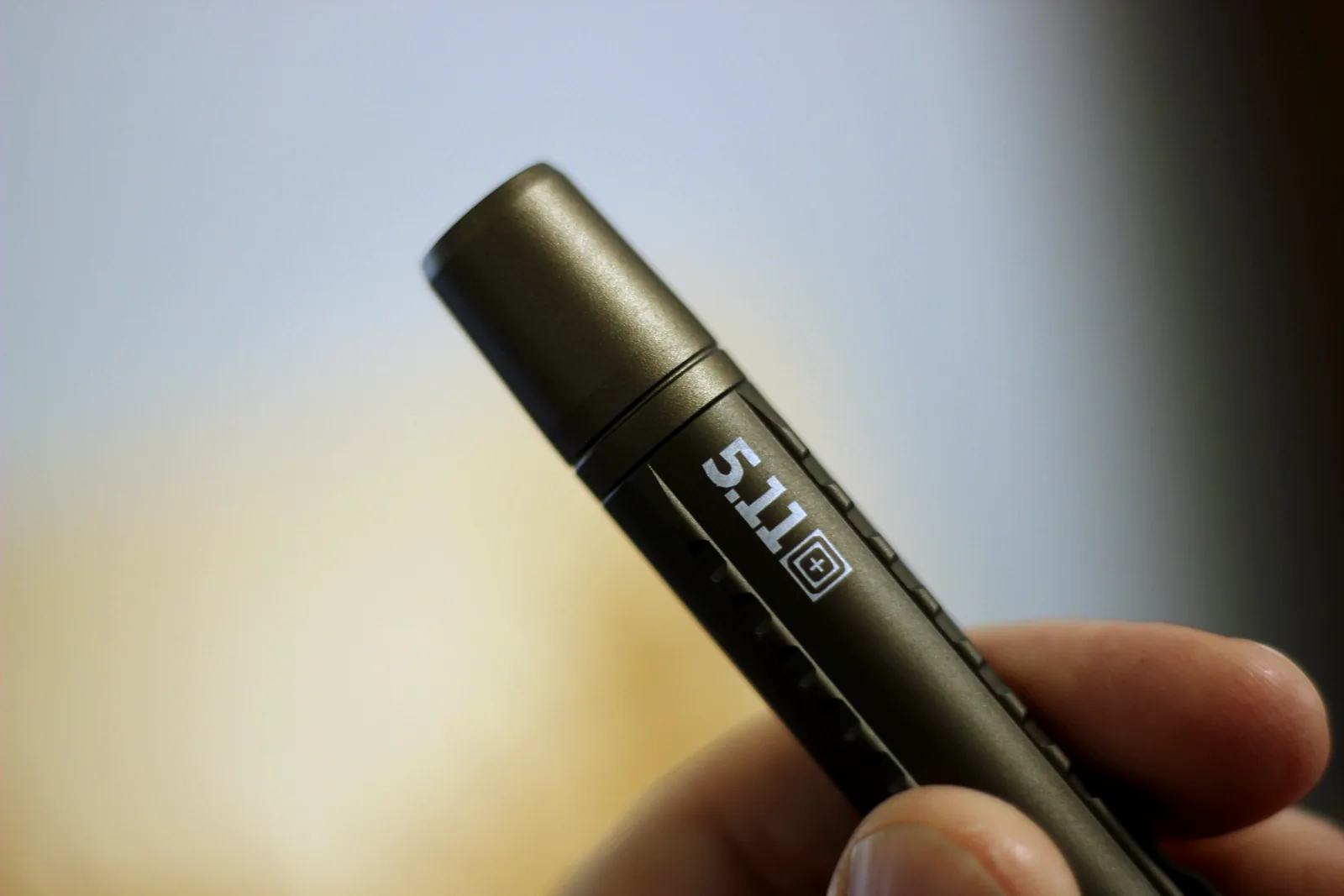 The 5.11 mark laser-etched into the anodised barrel of the flashlight