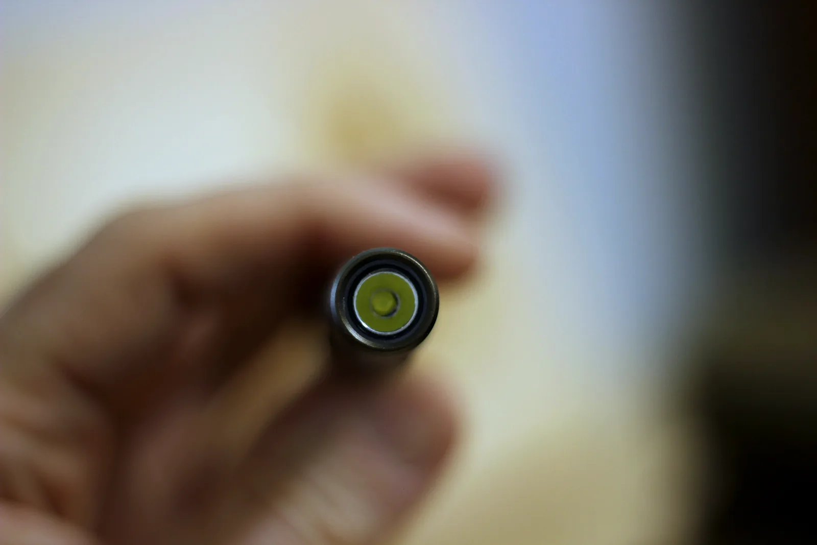 Head-on view of the flashlight showing the LED emitter seated in its reflector