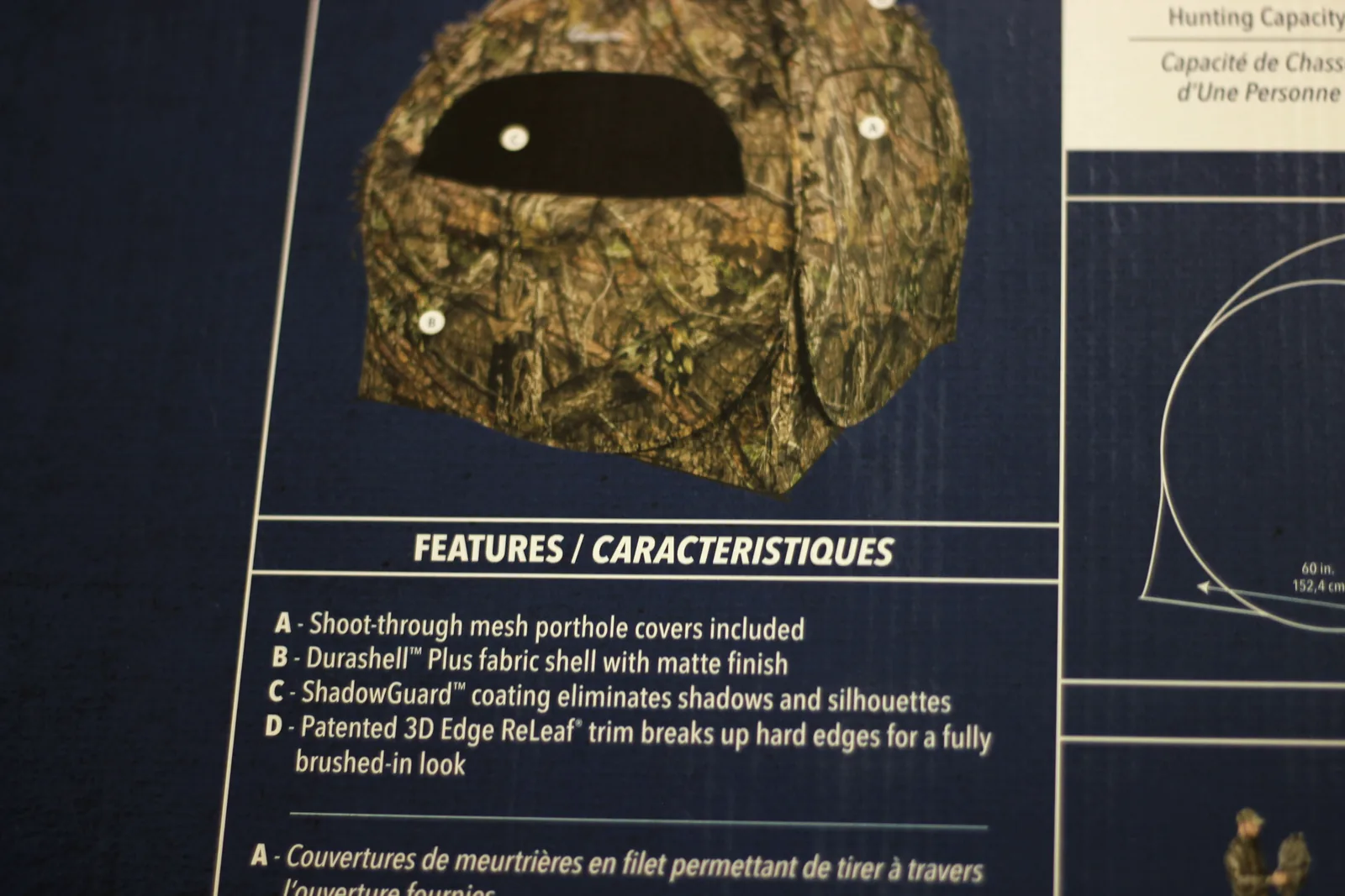 The features panel on the carton listing shoot-through mesh porthole covers, Durashell Plus shell, ShadowGuard coating and 3D Edge ReLeaf trim