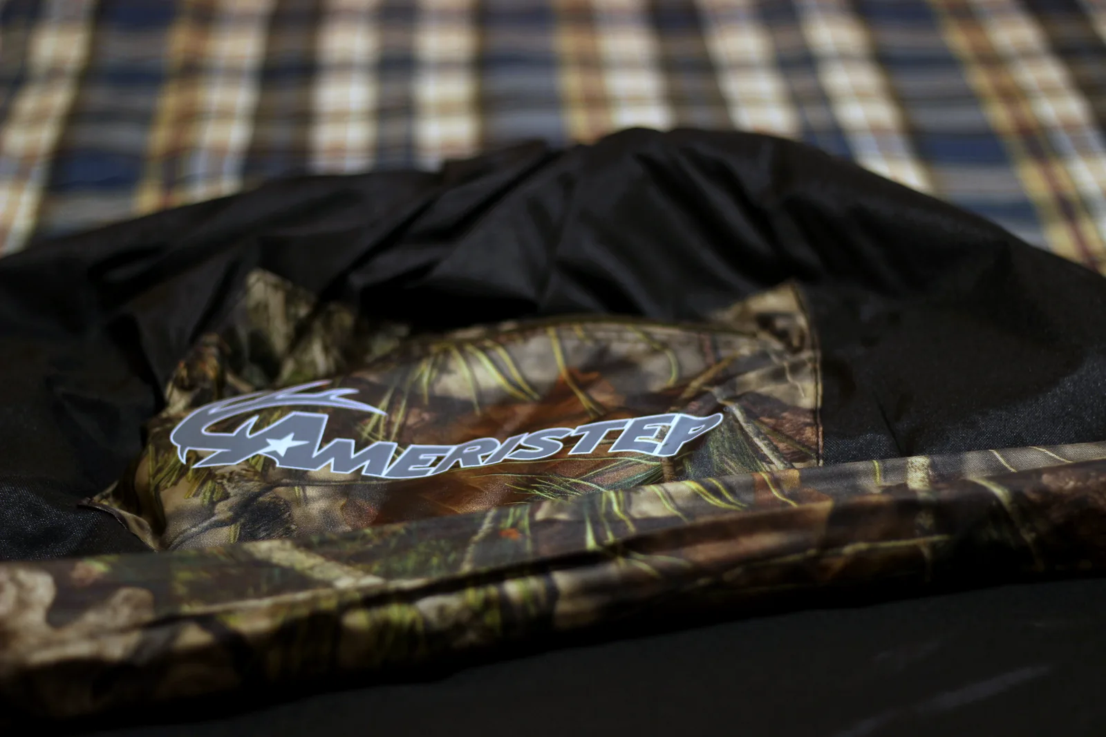 The folded blind inside its camo backpack carrying case
