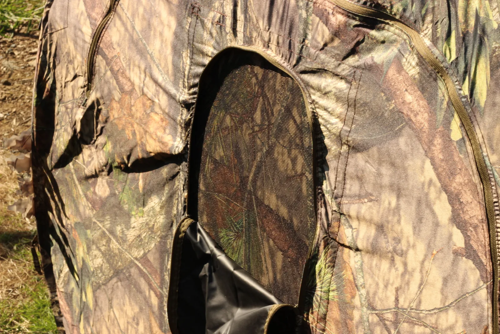 The blind's door panel unzipped and rolled back