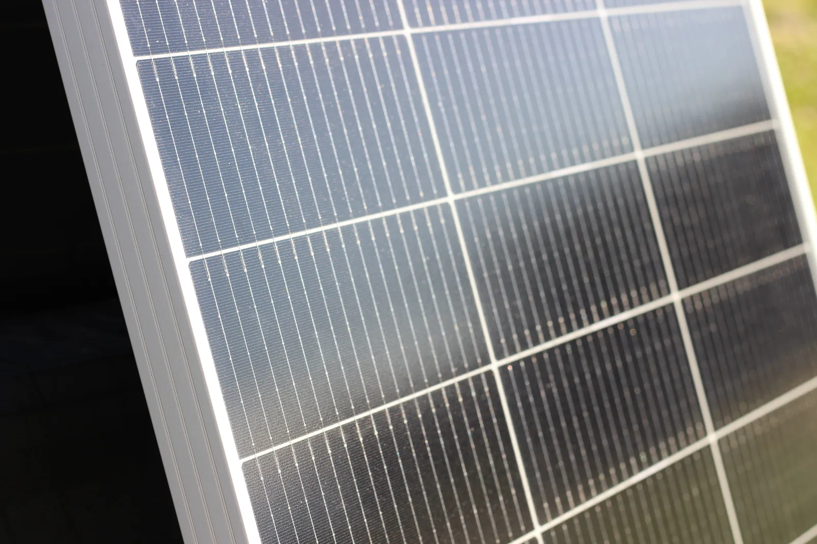 Solar panel propped against vehicle for charging