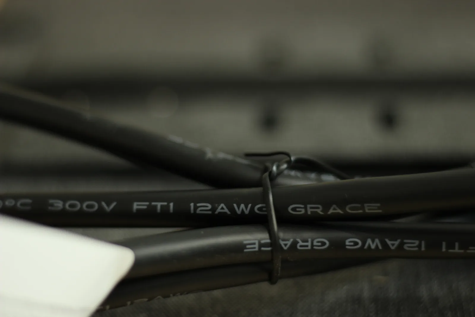 Close-up of the cable jacket printed with 300V FTI 12AWG GRACE