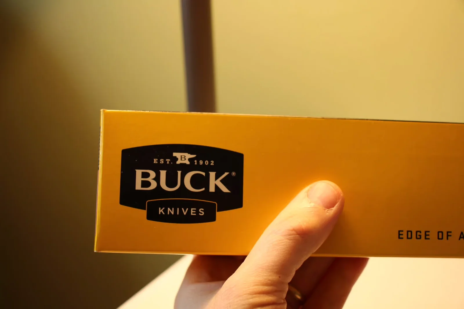 Buck Knives yellow box with the black anvil 'EST 1902' shield
