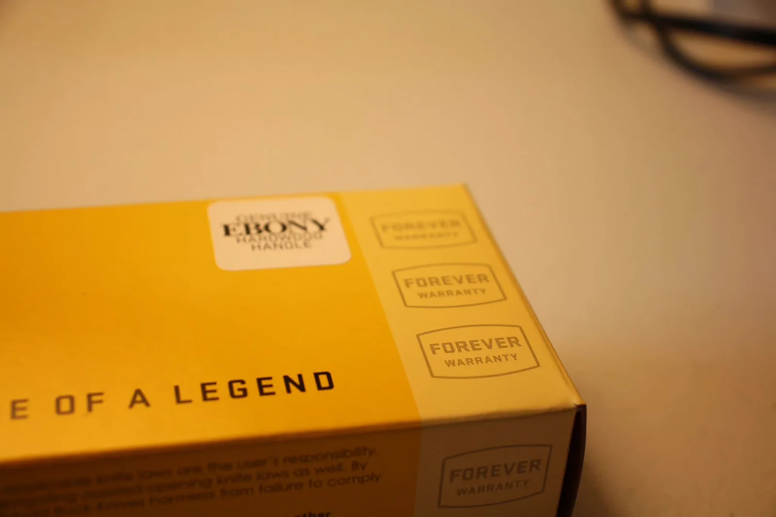 Box detail showing 'GENUINE EBONY HARDWOOD HANDLE' sticker and 'FOREVER WARRANTY' stamps