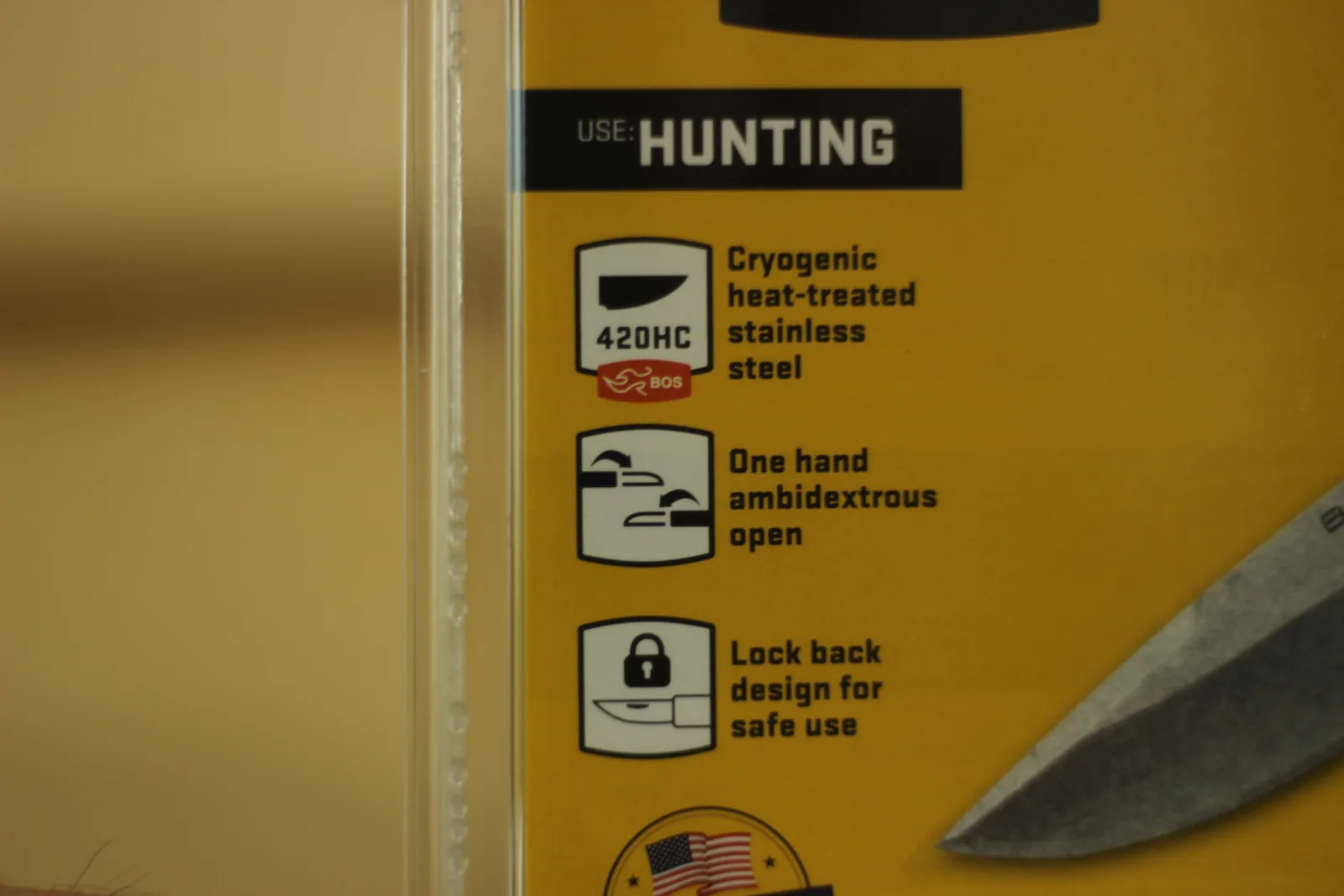 Close-up of three icons on the packaging: 420HC cryogenic heat-treated stainless steel, one hand ambidextrous open, and lock back design for safe use