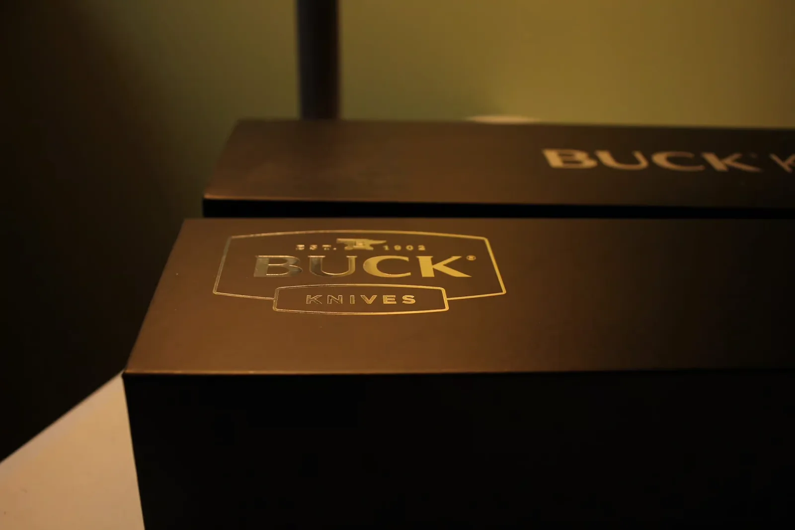 Closed Buck box exterior with gold "Est. 1902" branding