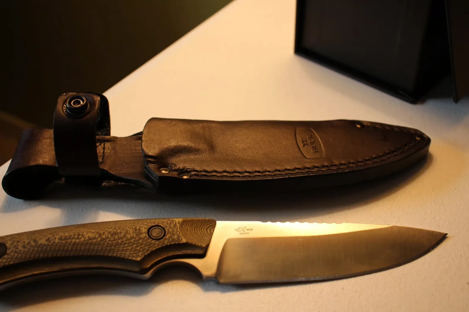 Steel markings — S35VN and BOS visible on the blade