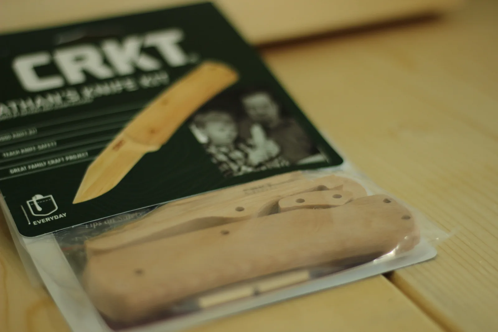The blister pack angled so the shaped beech parts are visible through the clear plastic against the green card