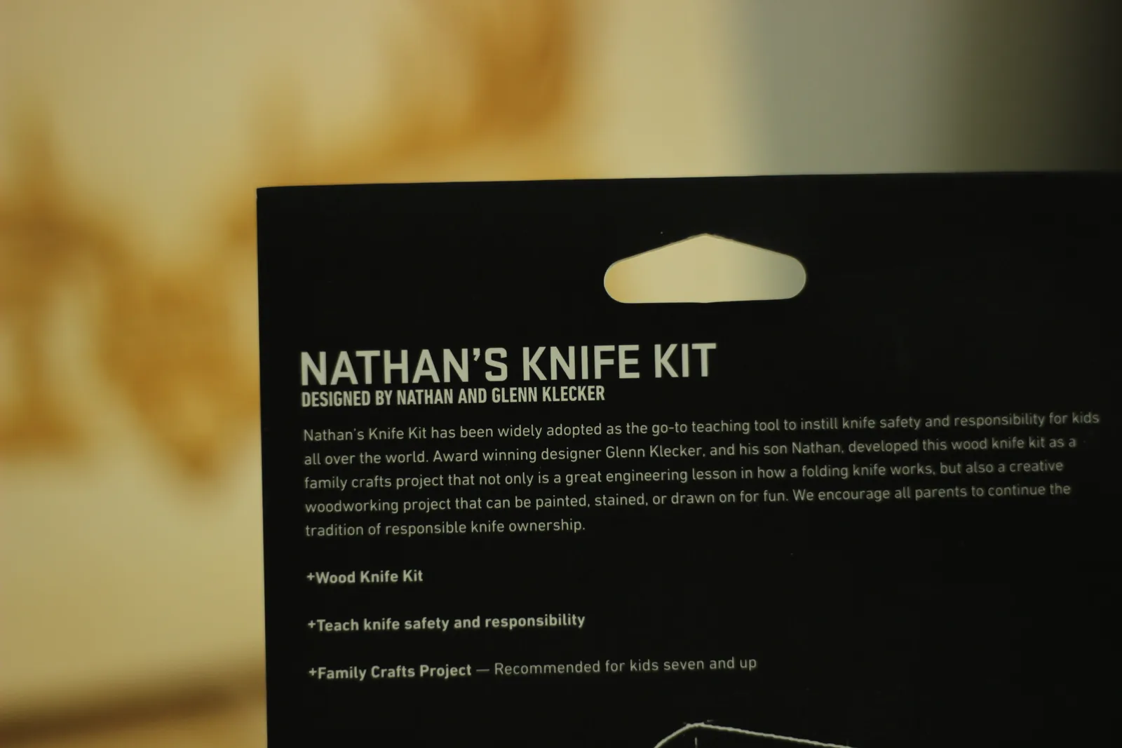 Text on the back of the card explaining that Nathan's Knife Kit was developed by designer Glenn Klecker and his son Nathan as a family crafts project