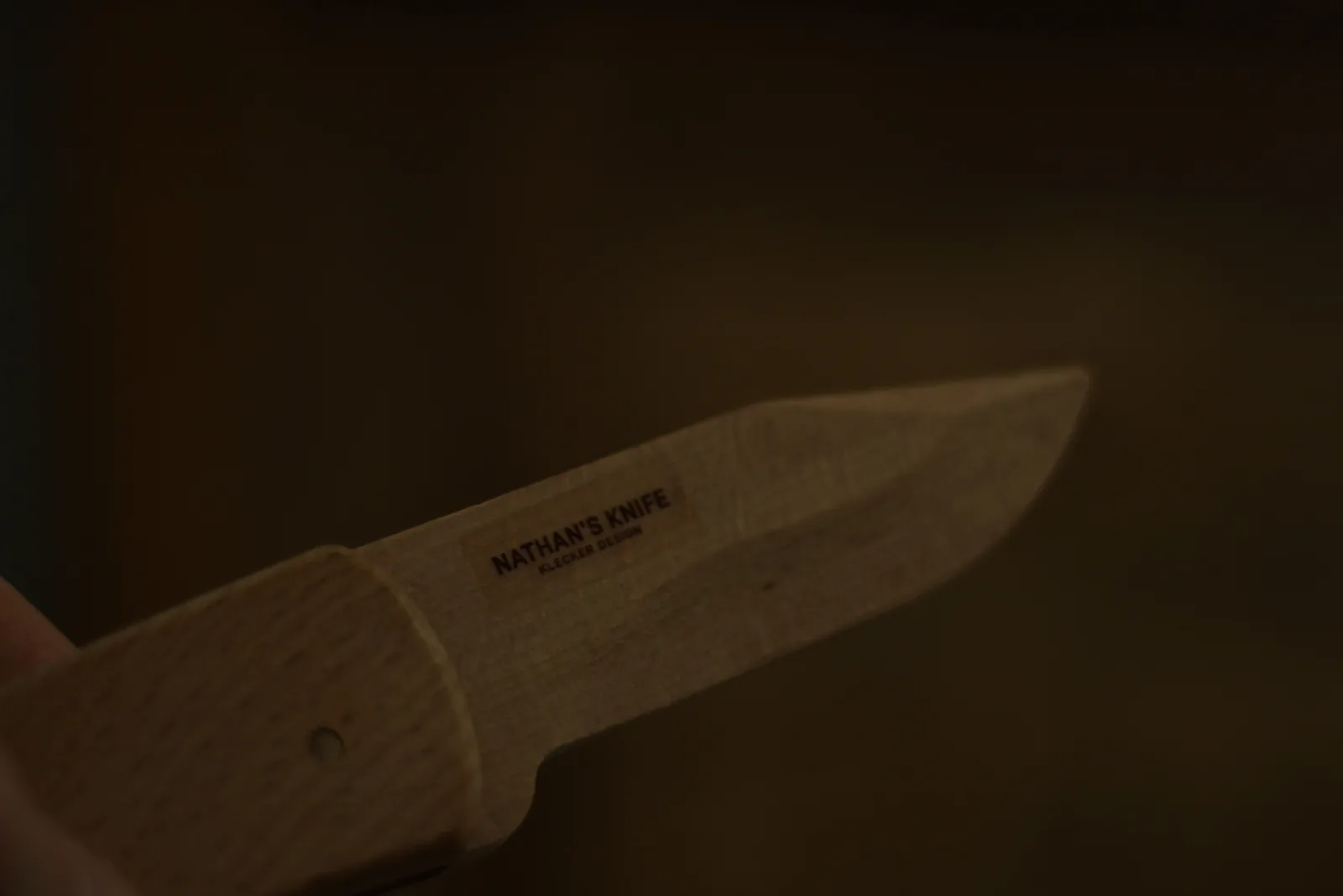 The reverse of the beech blade with NATHAN'S KNIFE and KLECKER DESIGN printed on the flat