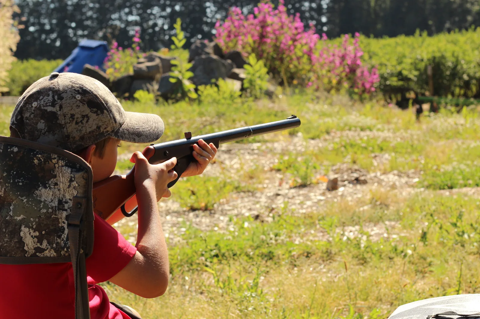 Between shots, lowering the rifle to reset