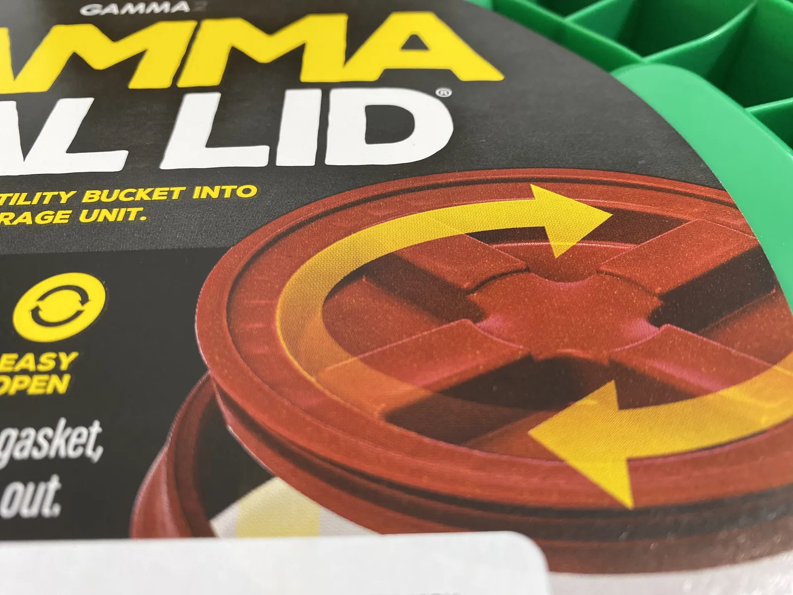 Close-up of the GAMMA Seal Lid retail label with the red bidirectional spin arrows and Easy Open icon