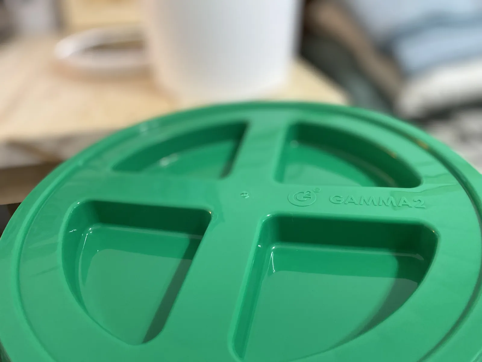 Box face of the GAMMA Seal Lid showing the full retail label with all four icons