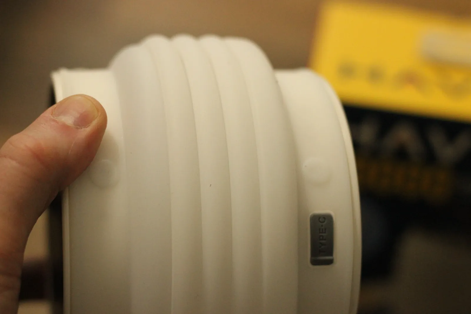 Hand on the collapsed HAVEN 10000 silicone body showing the Type-C label