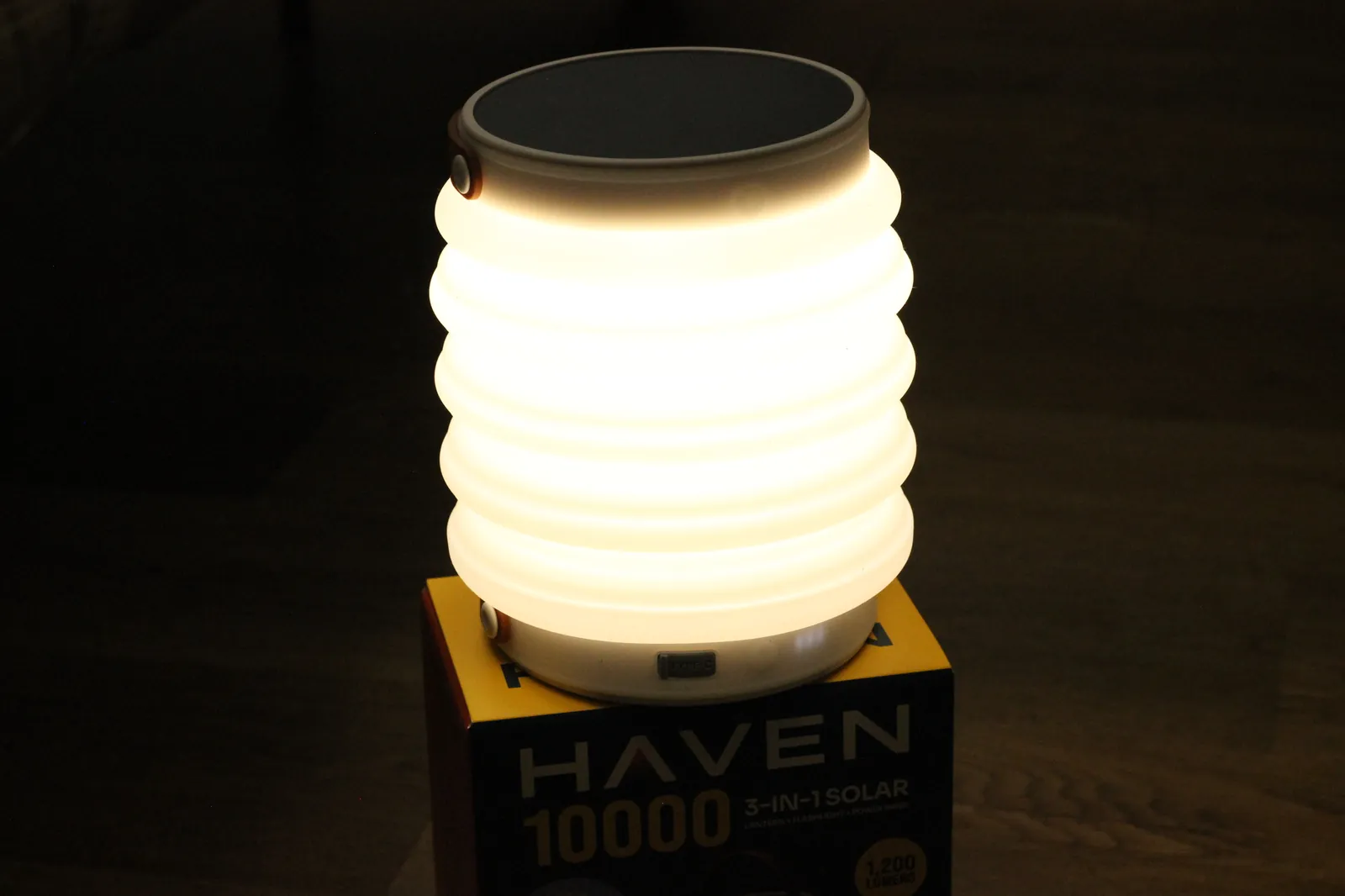HAVEN 10000 lit at night on top of its retail box