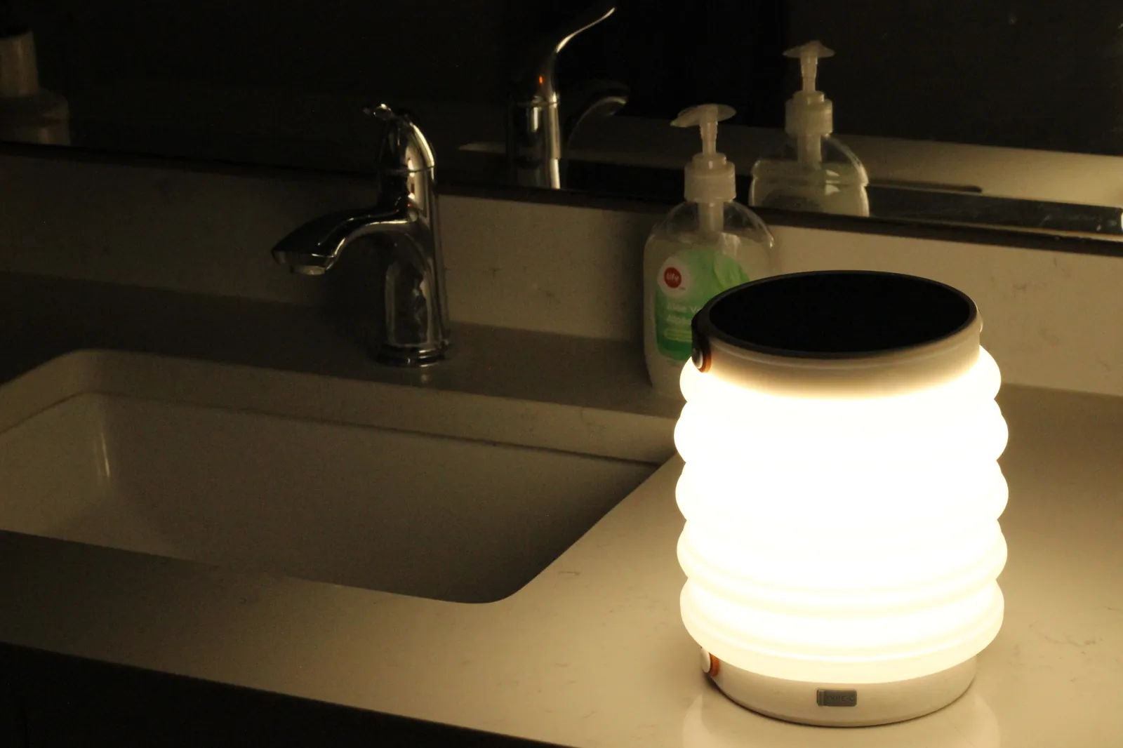 HAVEN 10000 in flashlight mode lit on a bathroom vanity countertop