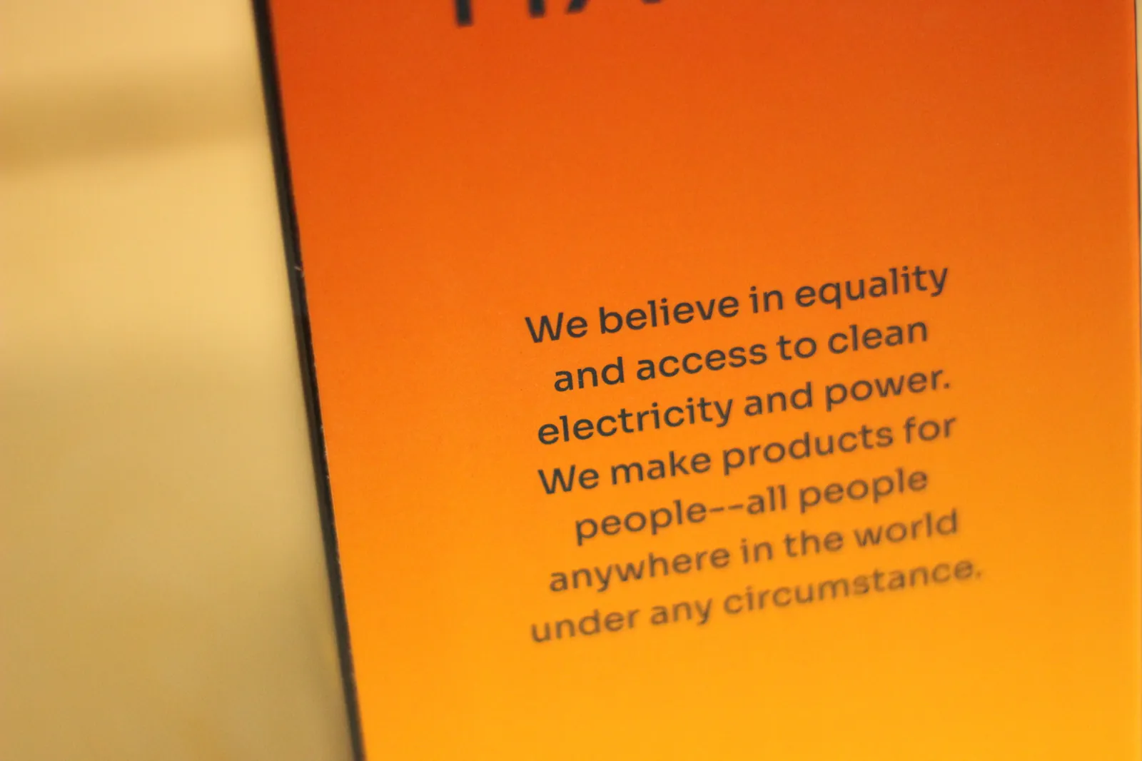 Close-up of the HAVEN 10000 box panel reading 'We believe in equality and access to clean electricity and power. We make products for people — all people anywhere in the world under any circumstance.'