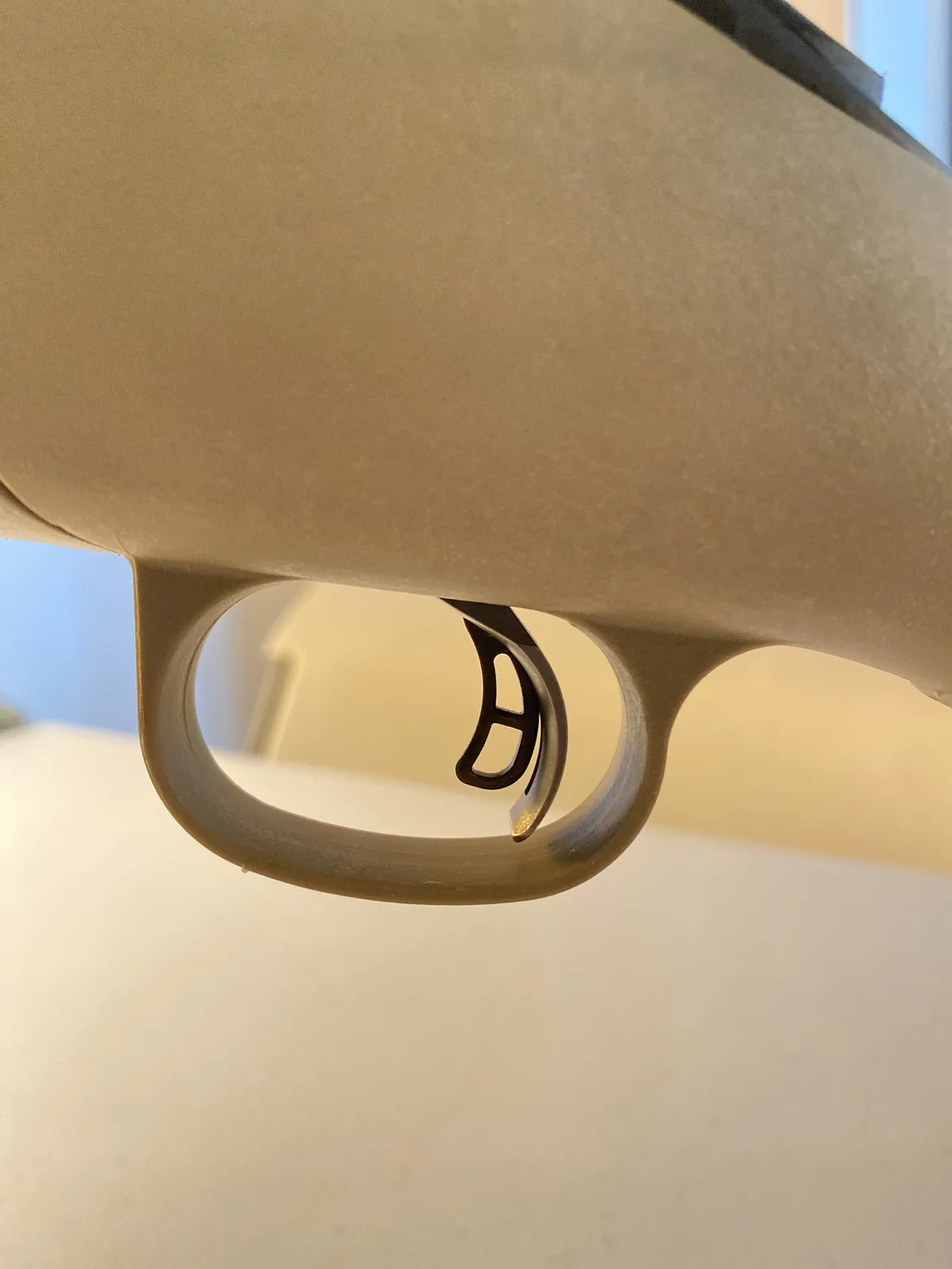 Trigger and trigger guard area of the Ruger American Ranch FDE stock, viewed from below