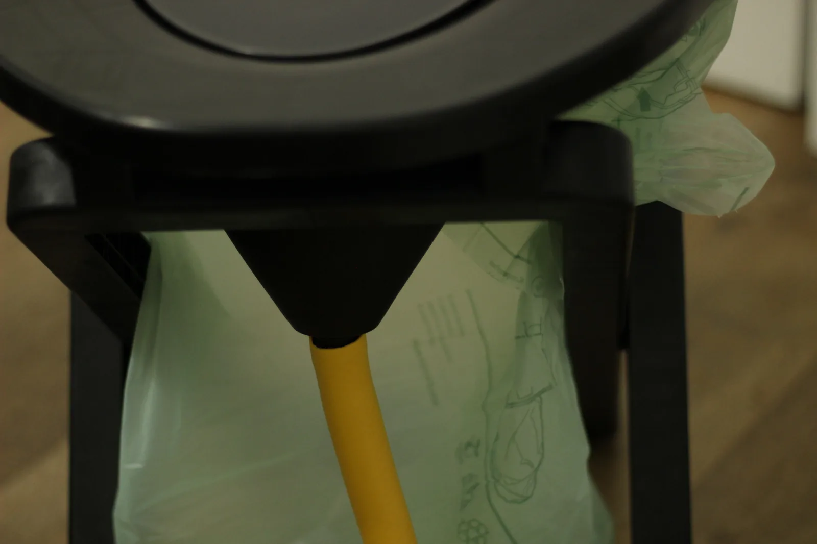 Yellow urine hose attached to the bottom of the separator bowl