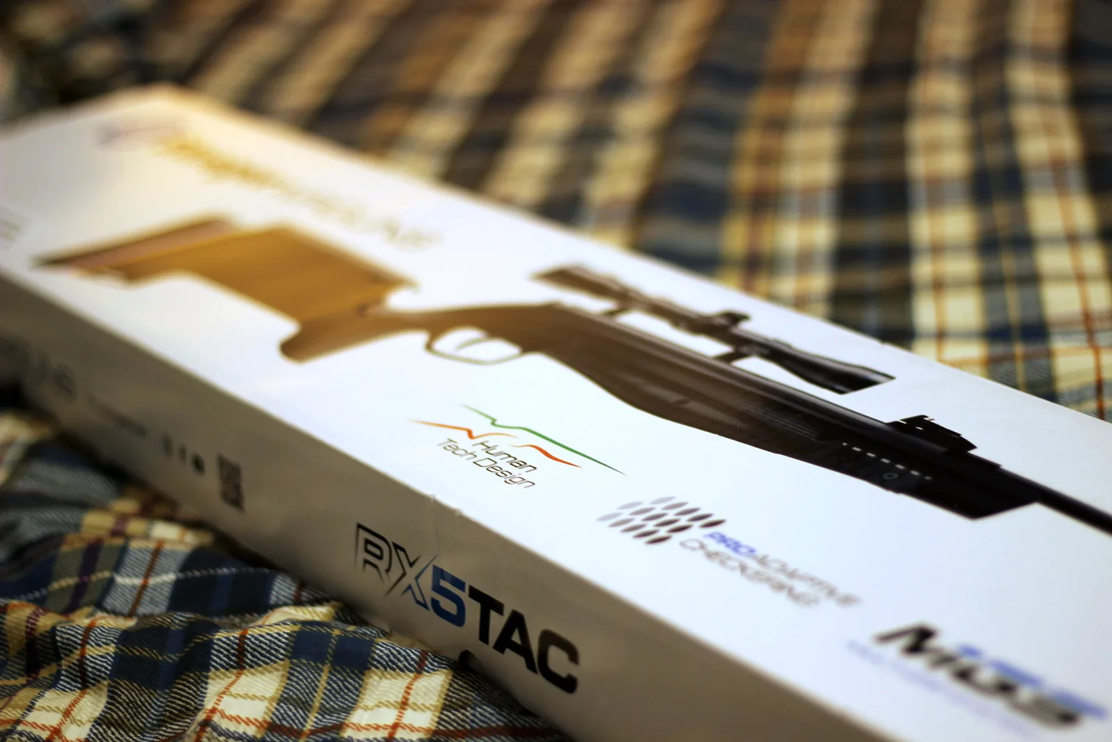 The side of the carton printed with an image of the rifle and the RX5 TAC model name