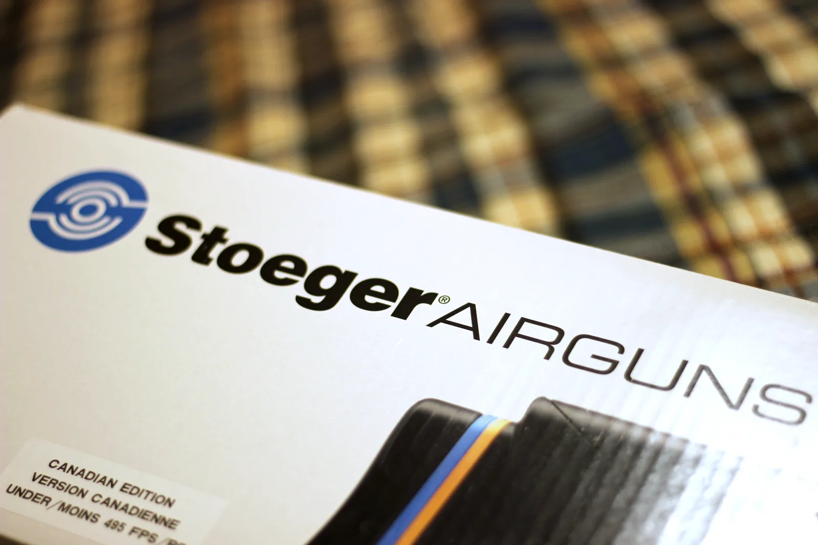 The blue Stoeger Airguns logo printed large on the carton