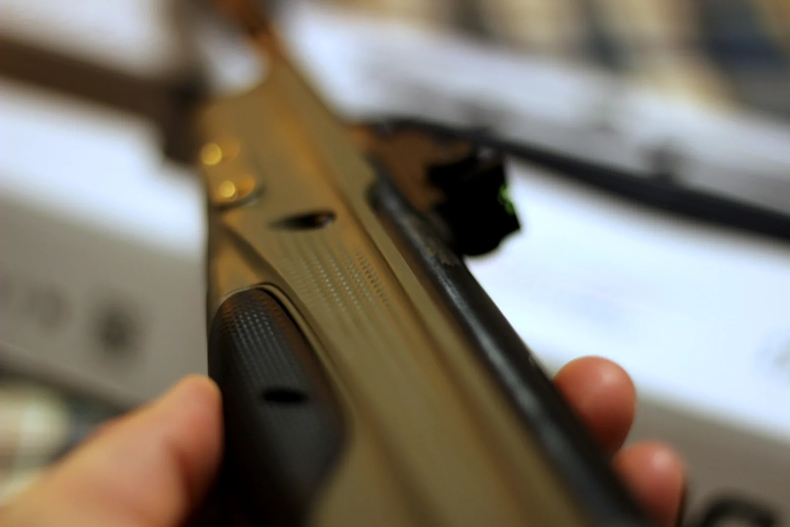 The moulded cocking grip at the muzzle end of the barrel