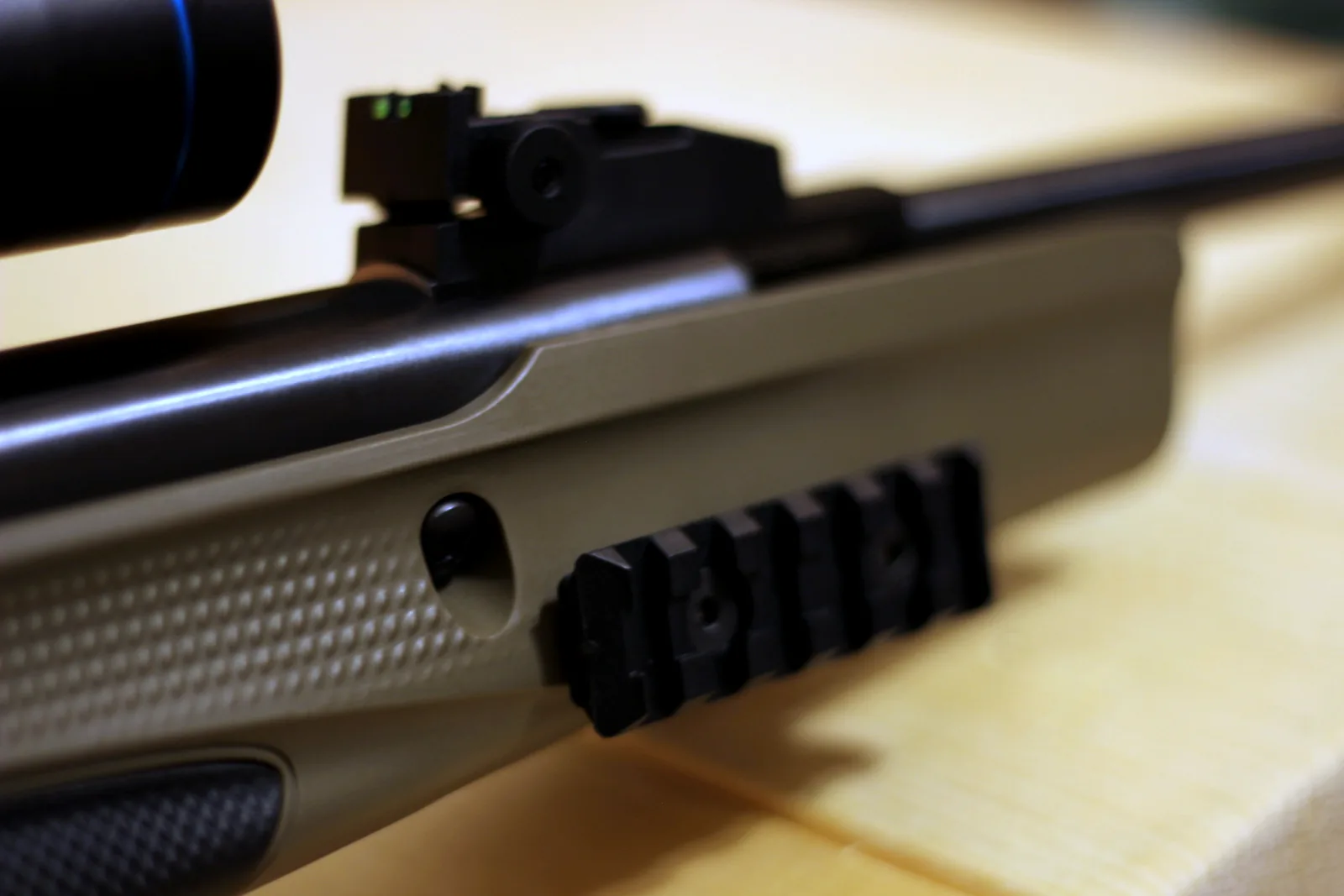 The receiver rail photographed from the side along the length of the rifle