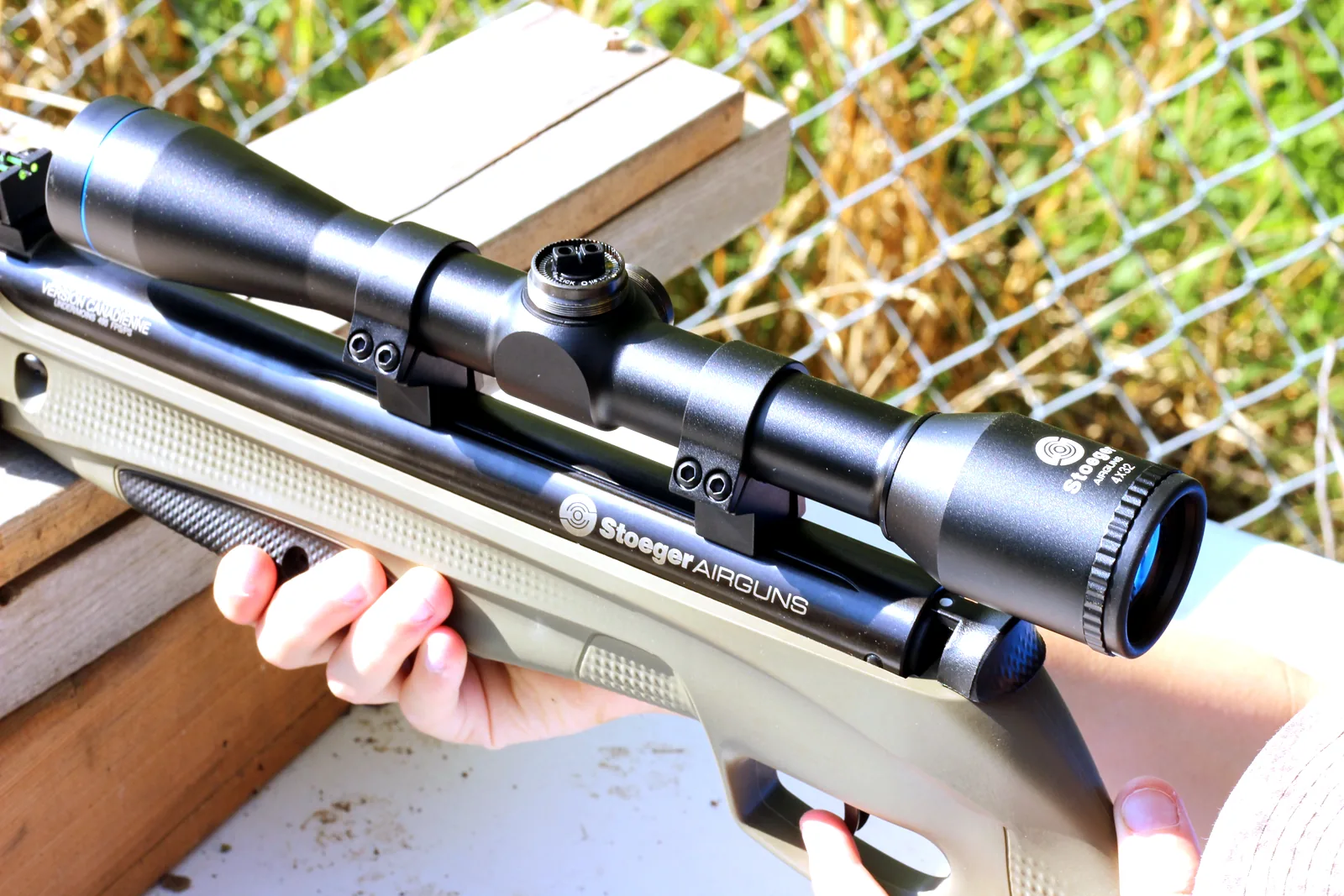 The young shooter closing the barrel of the rifle back against the receiver