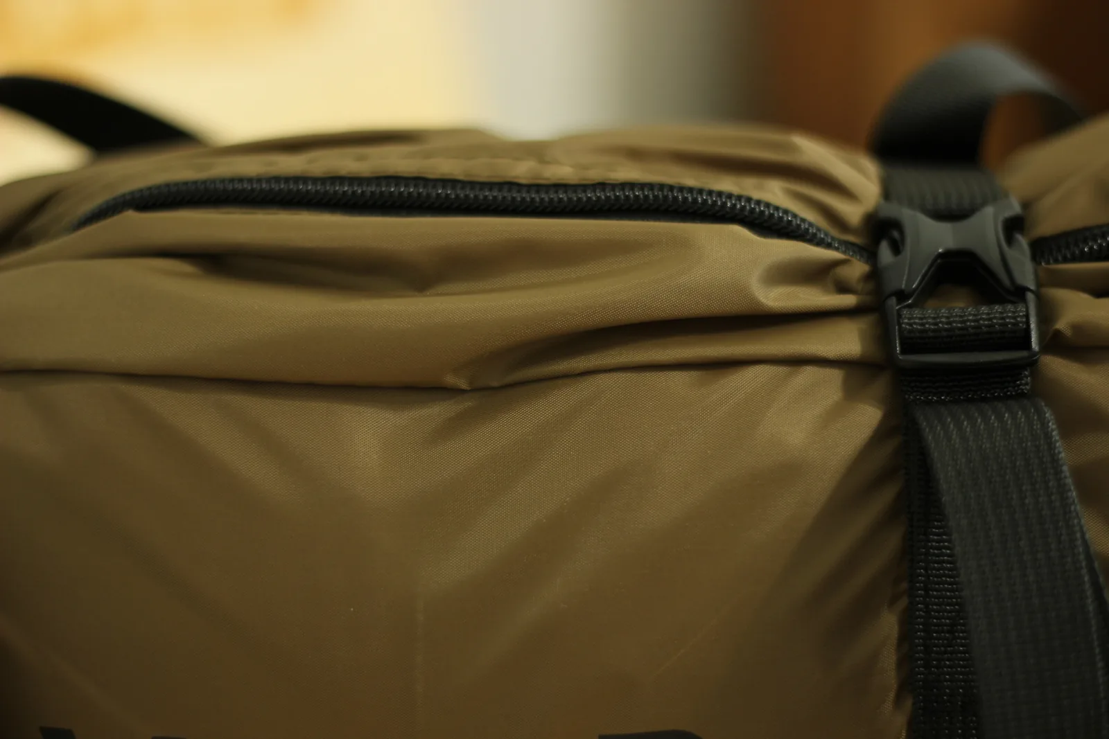 The full-length zip on the stuff bag with a webbing strap anchored beside it