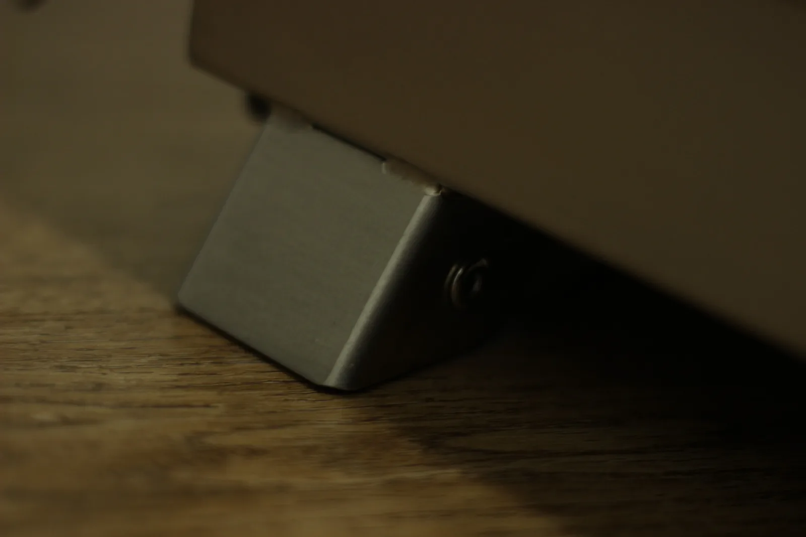 One of the folding stainless legs deployed beneath the stove body